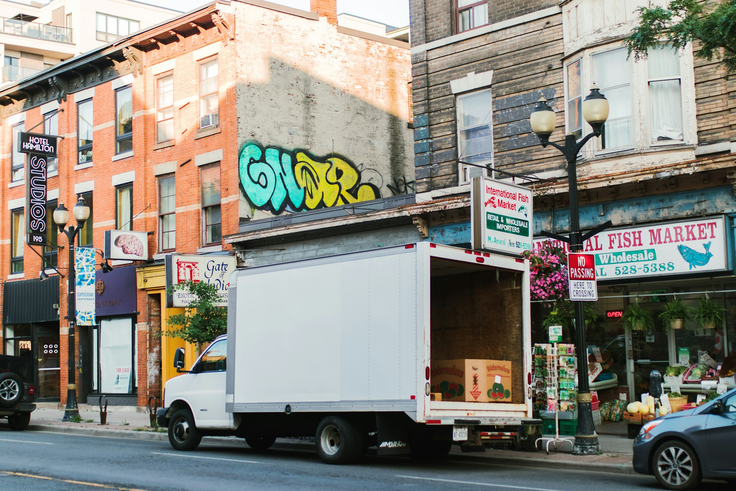 White box truck traveling on a city street
