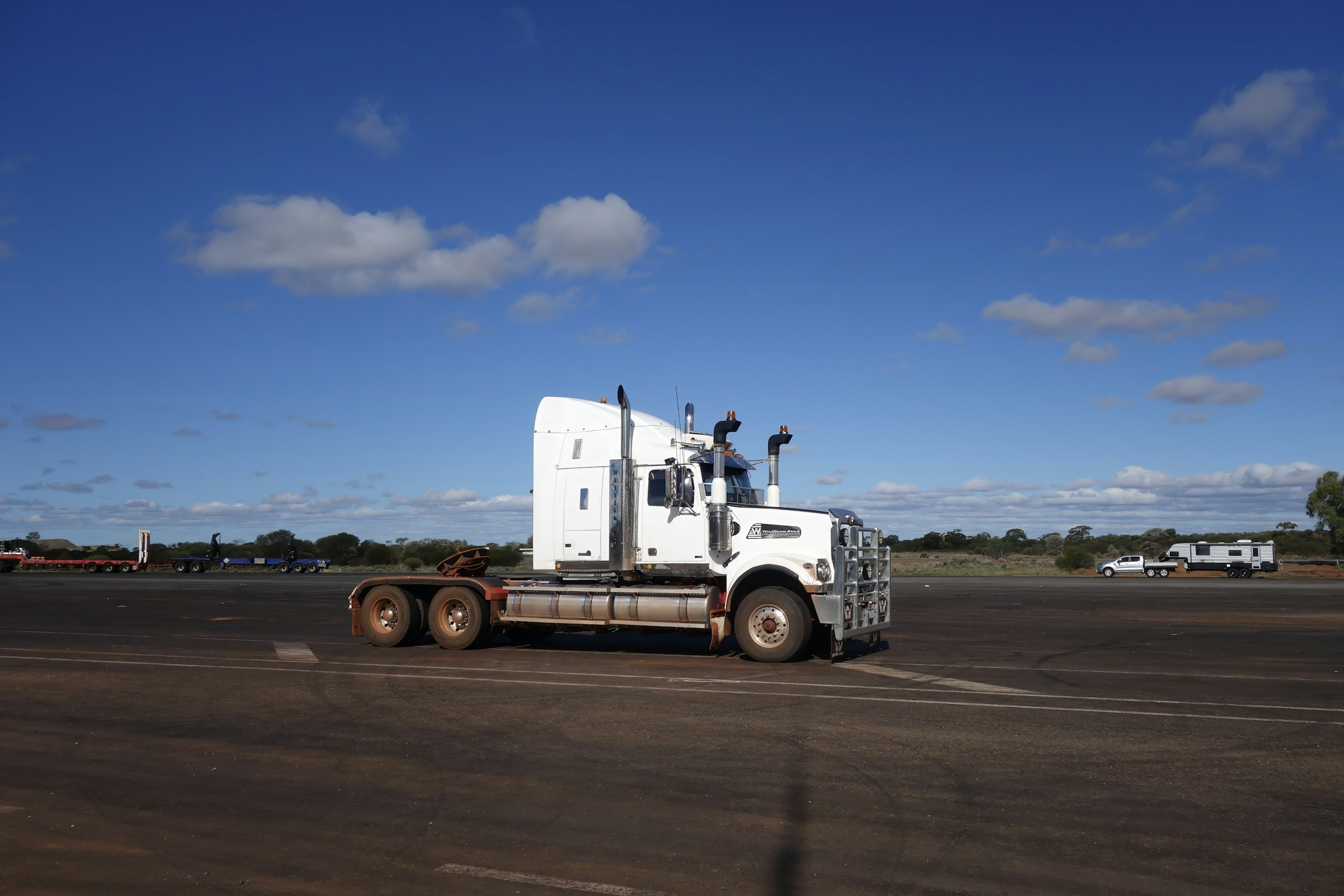 White semi truck parked on asphalt