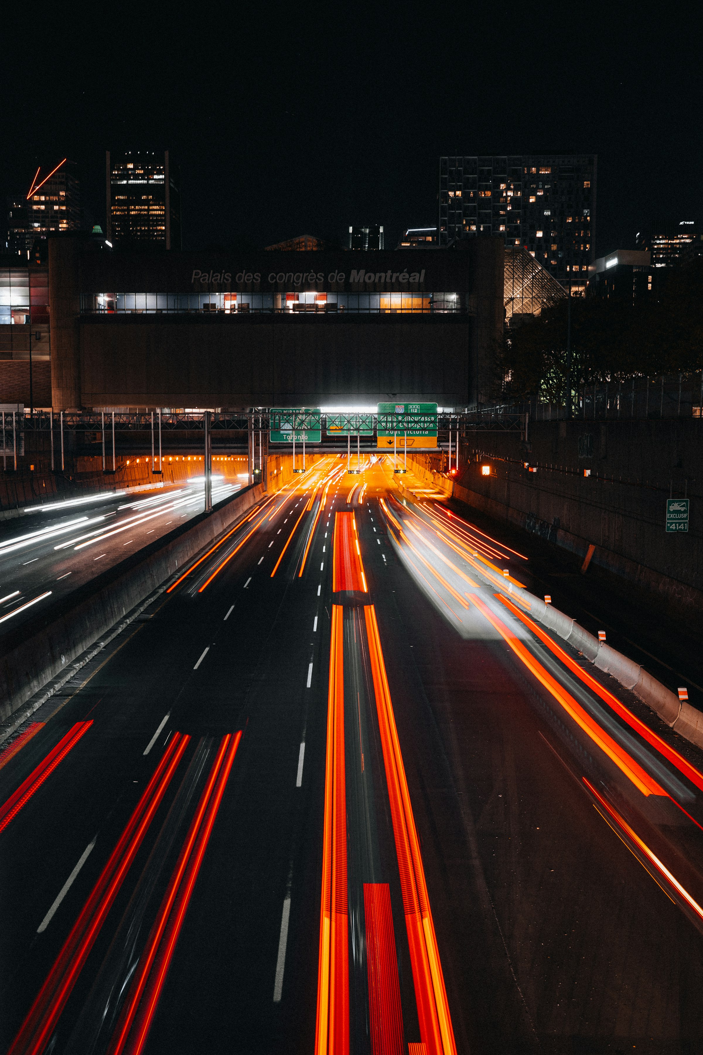 Highway traffic leaving light trails after dark